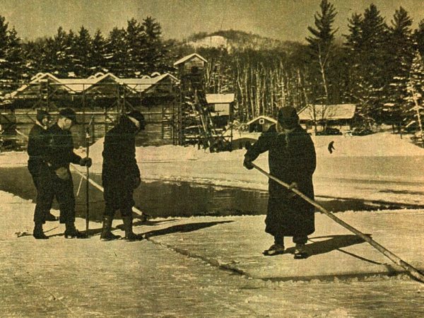 A group harvesting a raft of ice on Moody Pond in Saranac Lake