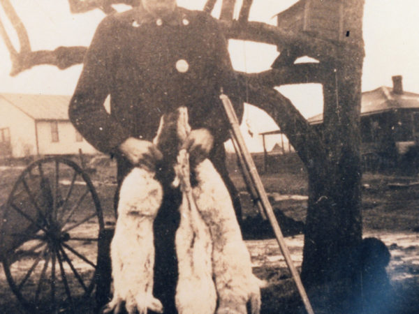 Roger Dake with long gun and rabbits in Oak Point