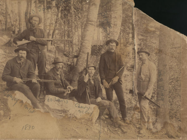 Adirondack guides posed outside Saranac Lake