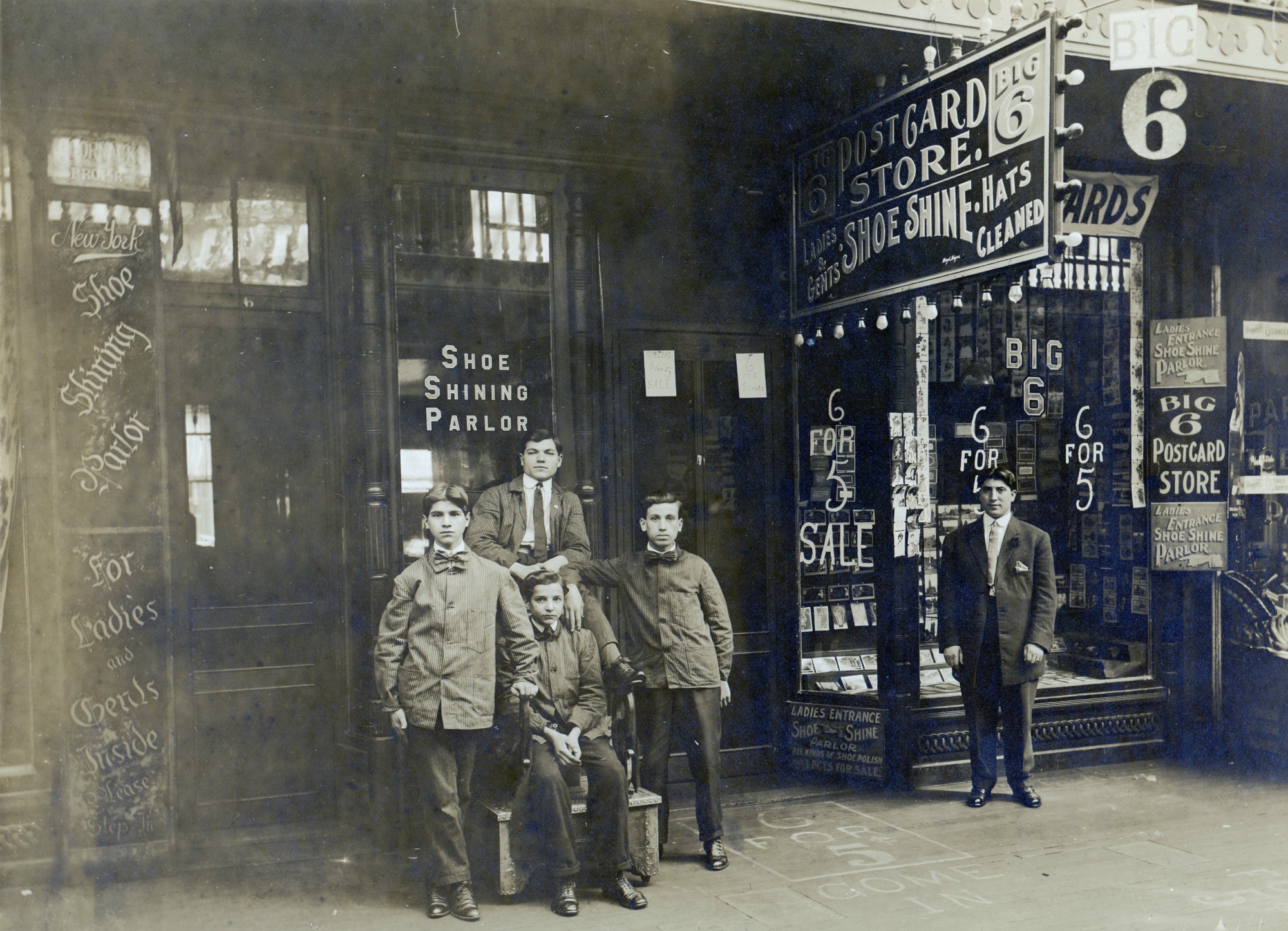 Boys working at a shoe shine shop in Watertown