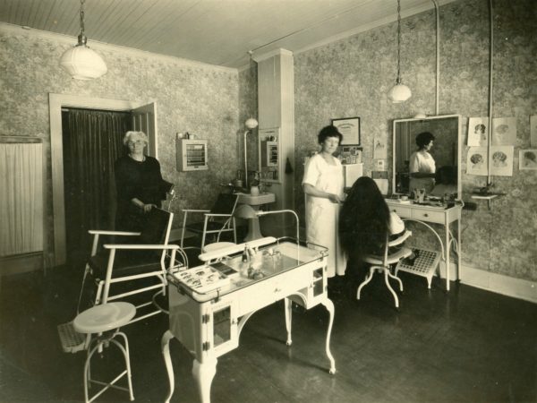 Hairdresser and customer at the Madam Gernnades Beauty Parlor in Watertown