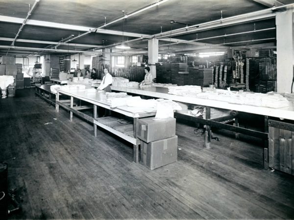 Folding shirts inside the Geo Sweetser & Son Shirt Factory in Watertown