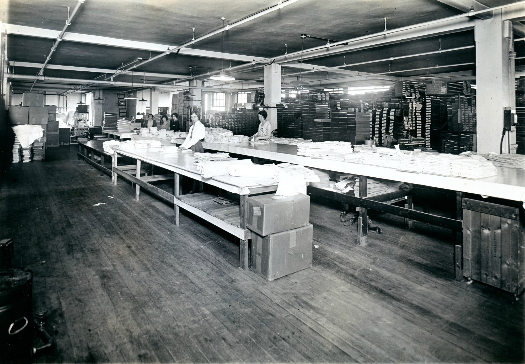 Folding shirts inside the Geo Sweetser & Son Shirt Factory in Watertown