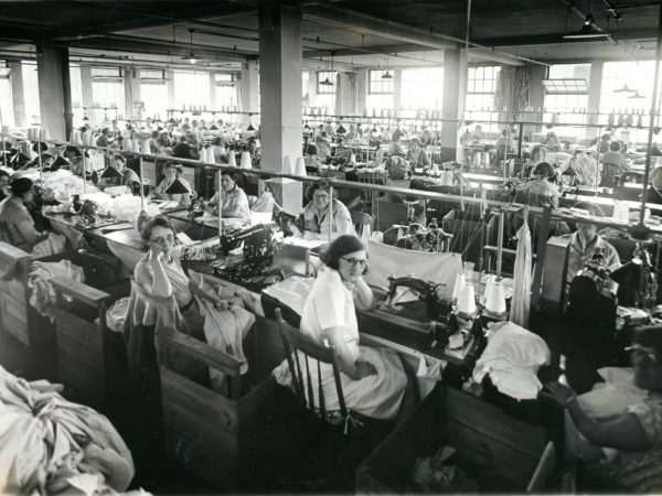 A room full of workers at the Geo Sweetser & Son Shirt Factory in Watertown