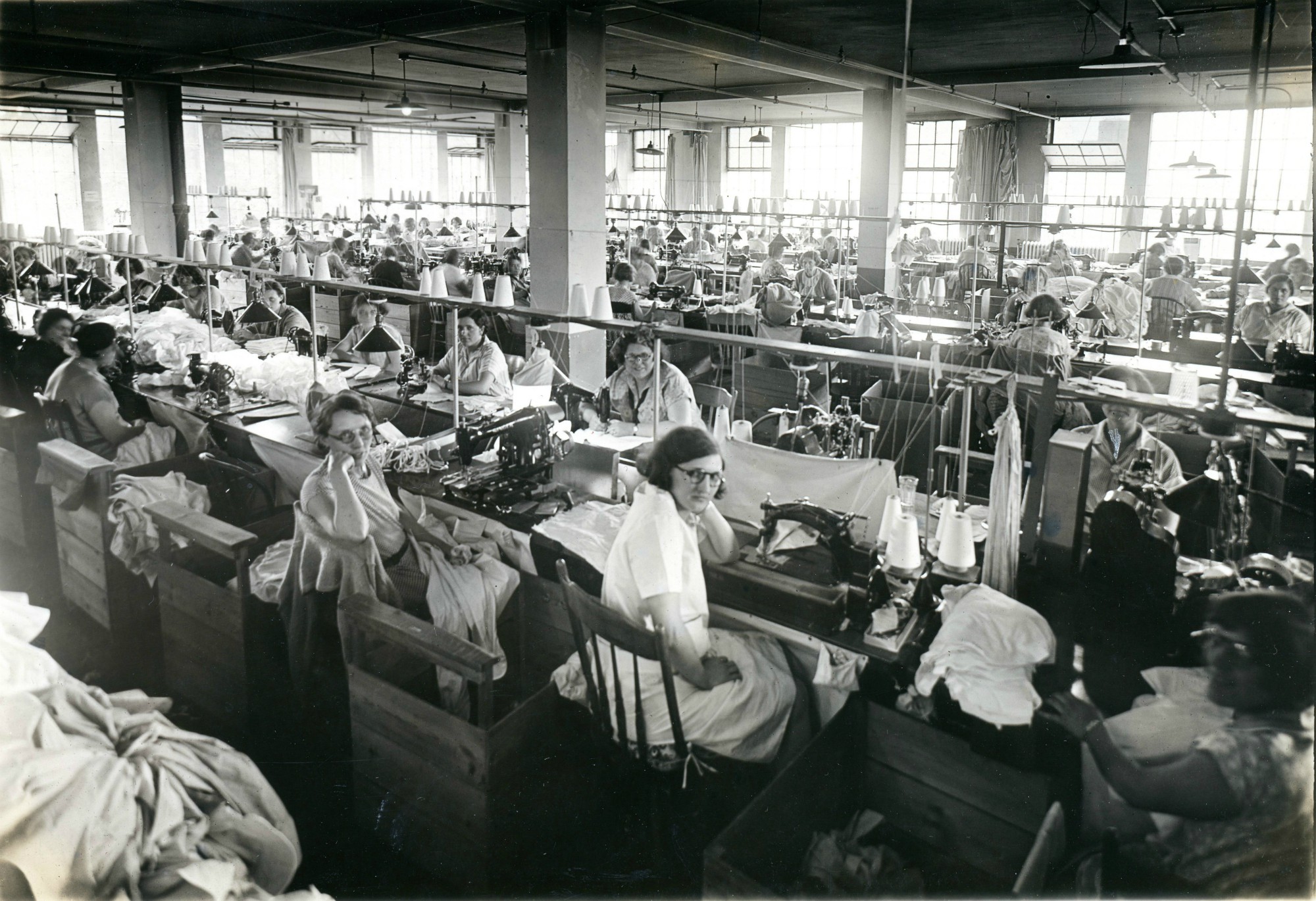 A room full of workers at the Geo Sweetser & Son Shirt Factory in