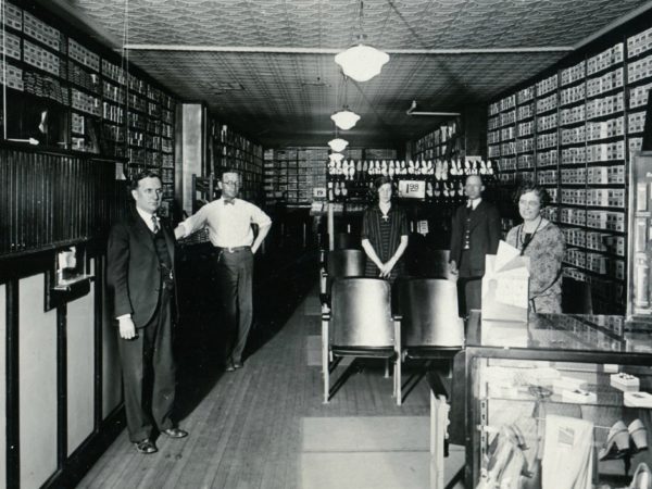 Employees inside G.R. Kinney Company Shoes in Watertown