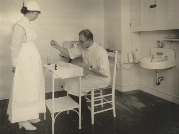 A doctor and nurse in a Trudeau Sanatorium lab in Saranac Lake