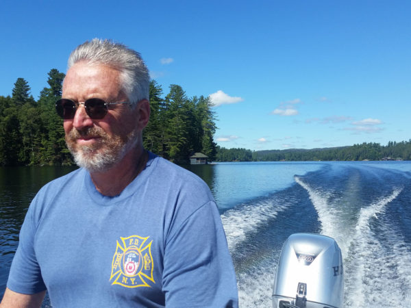 Caretaker Pete McConville driving on Upper Saint Regis Lake