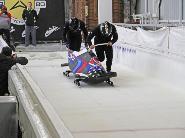 Olympic bobsledders at the Mount Van Hoevenberg sliding track in Lake Placid