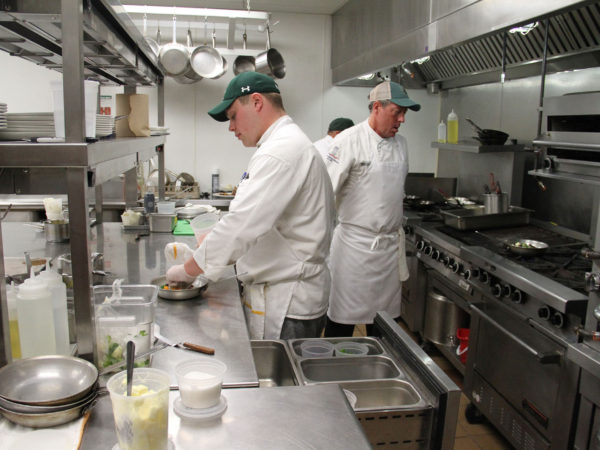 Chef Kevin McCarthy working the vegetable station at The Ganzi at Paul Smith's