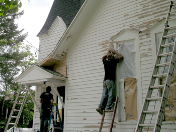 Repairing the siding of the Wanakena Presbyterian Church