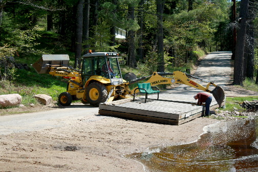 Moving the Wanakena Town dock back into the Oswegatchie River