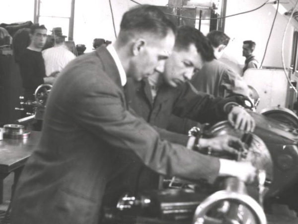 Operating a metal lathe at the SUNY Canton Agricultural and Technology College