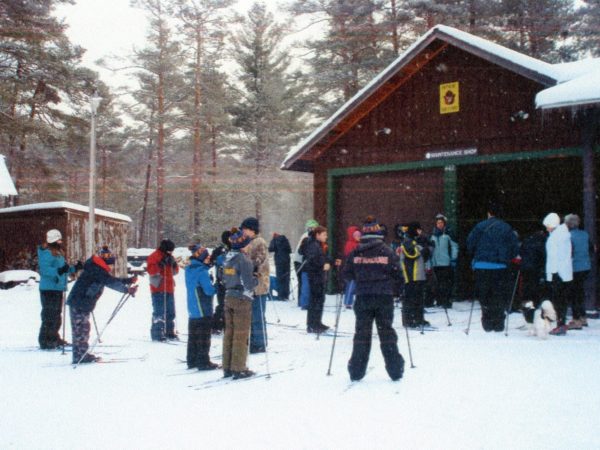 Volunteer ski instructors with ski students at Higley Flow State Park in Colton