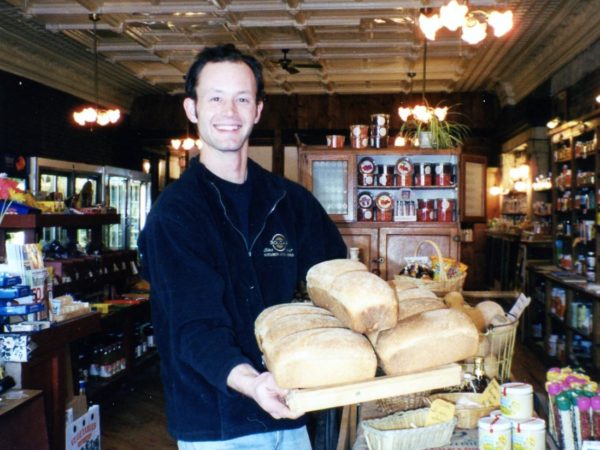 A Nature’s Storehouse employee with freshly baked bread in Canton