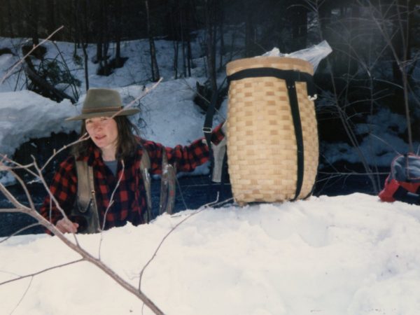 Working in a snowbank while treating black flies in Colton