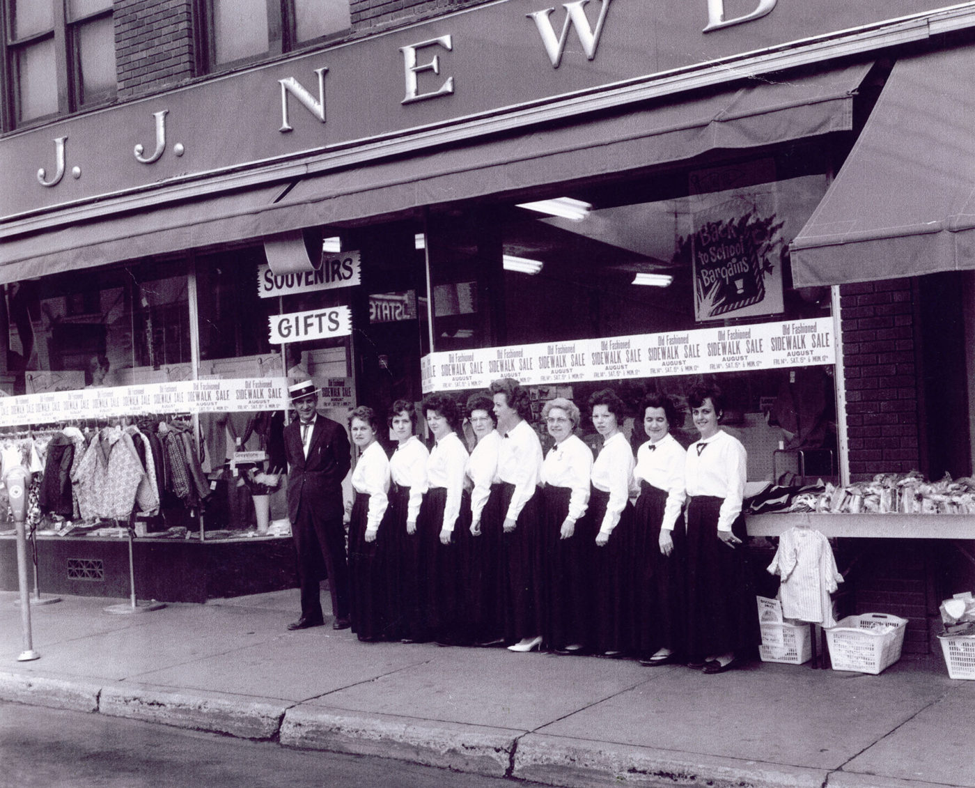 Employees in front of the J.J. Newberry department store in Tupper Lake