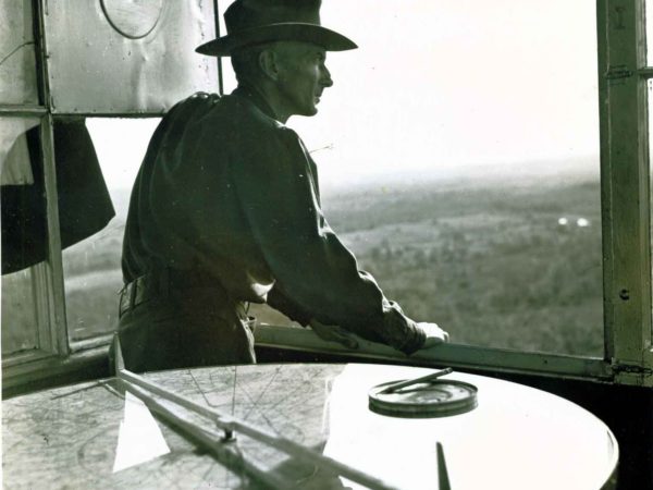 Fire warden looks out from a fire tower in the southeastern Adirondacks