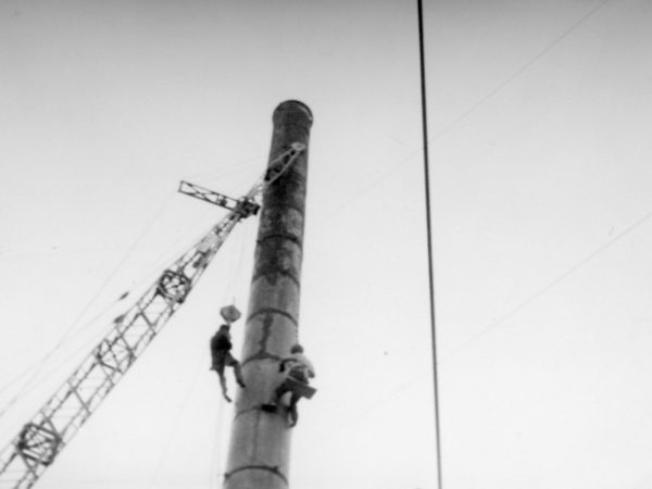 Coal plant workers on a smokestack in Plattsburgh