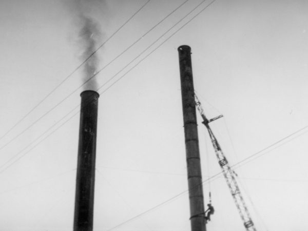 Worker atop a smokestack at a coal plant in Plattsburgh