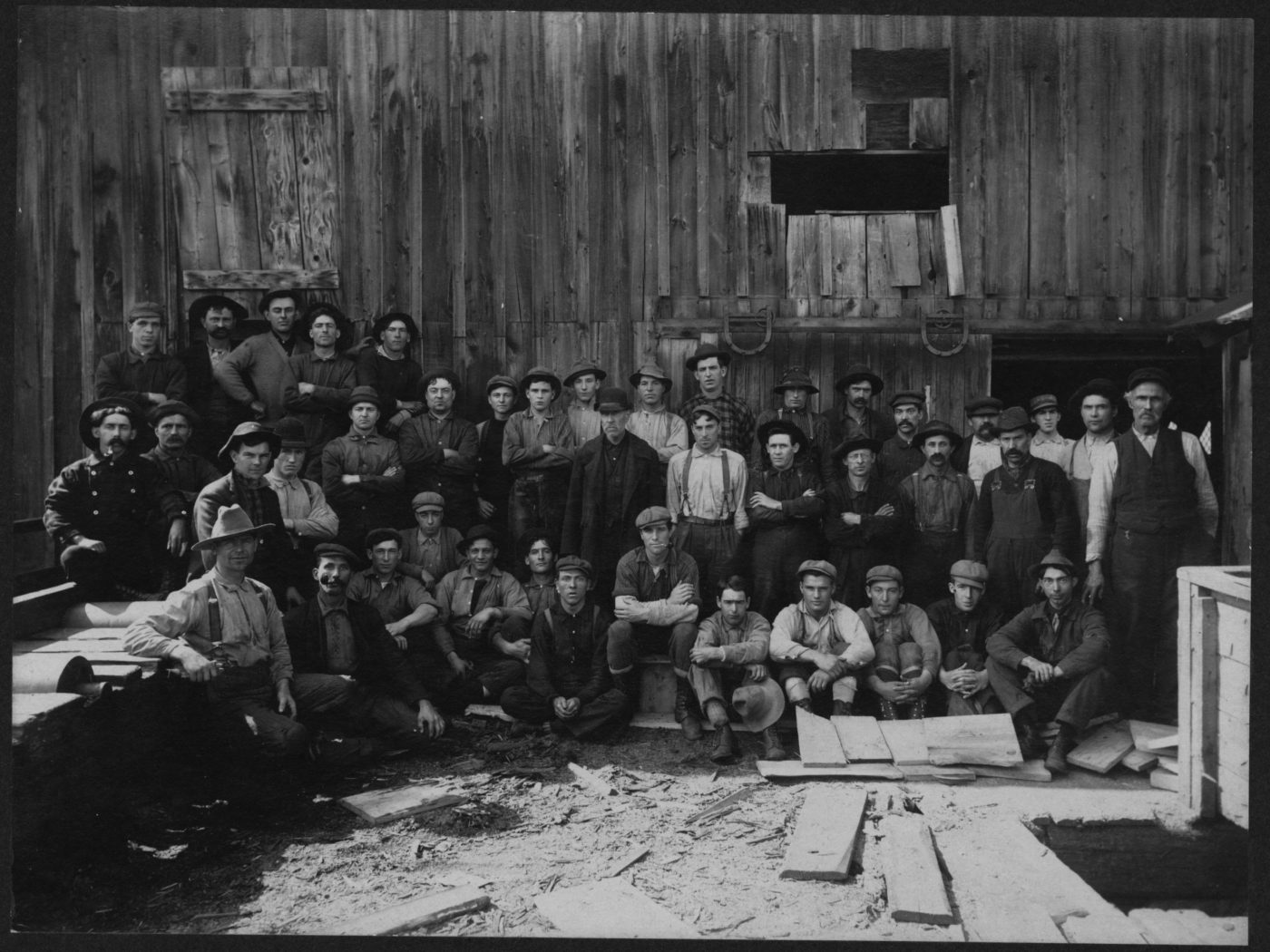 Workers at a sawmill in Tupper Lake