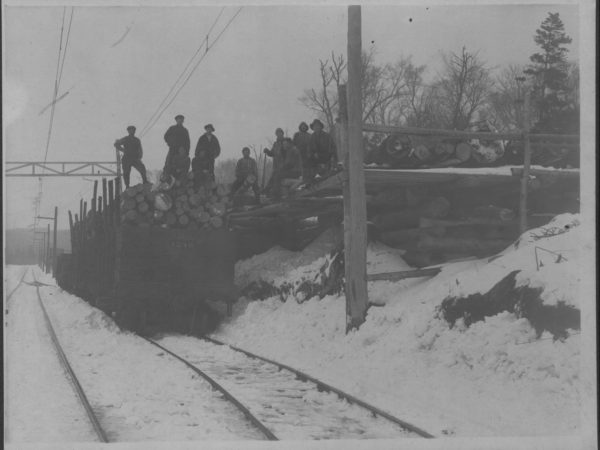 Loading a train car with logs in Tupper Lake