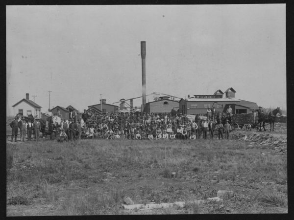 Workers posed outside the Brooklyn Cooperage Plant in Tupper Lake