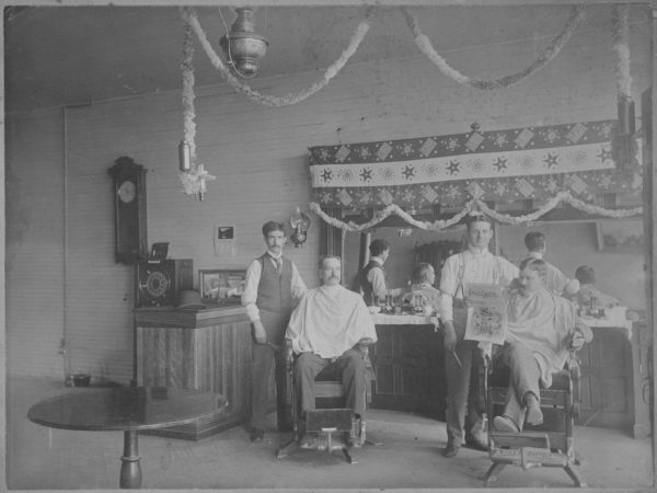 Two barbers at work in Tupper Lake