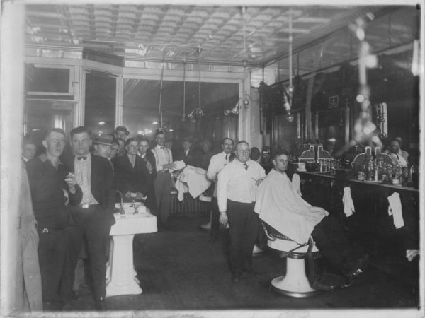 A crowded barbershop in Tupper Lake