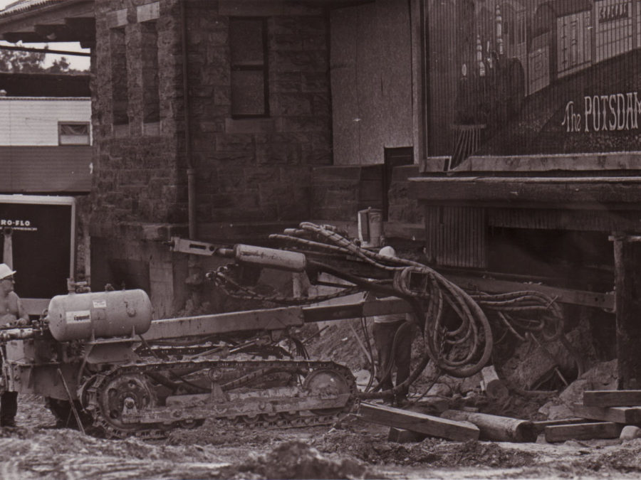 Howard Pelletier operating logging machinery in North Creek