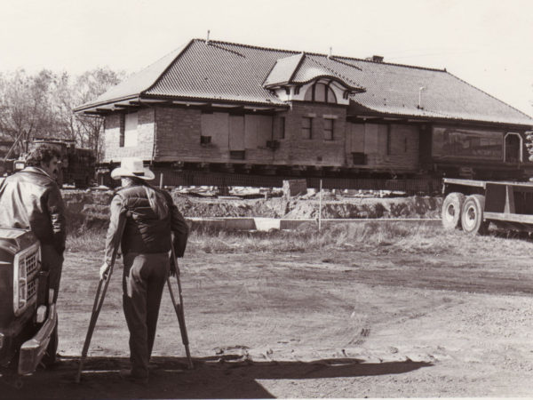 Two Men Stand outside of the Potsdam Depot in Potsdam, NY