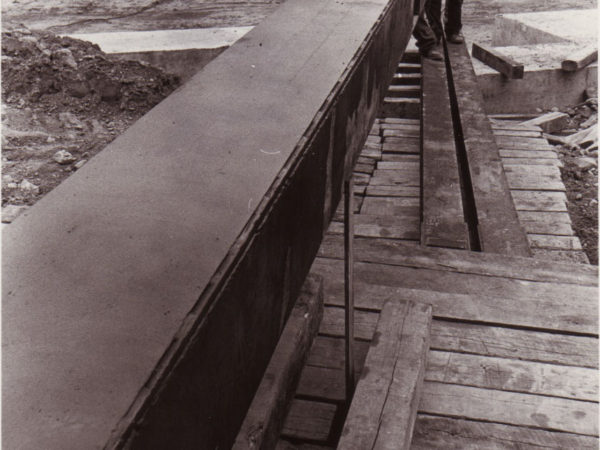 Two Workers Standing by the steel framework Used to Move the Depot in Potsdam, NY