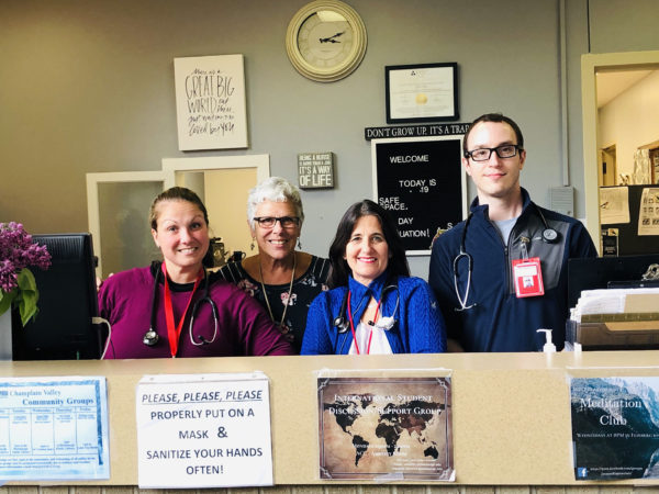 Dr. Kathleen Camelo poses with her staff in Plattsburgh