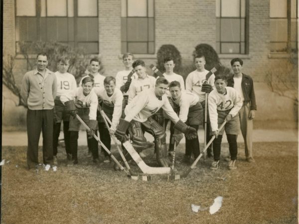 Coach George Brown with his first hockey team in Alexandria Bay