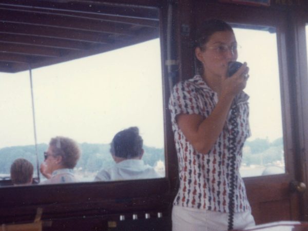 Barbara Brown announcing on a boat tour in Alexandria Bay