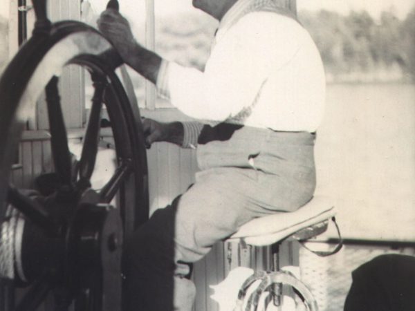 Captain at the helm of a ferry in Alexandria Bay