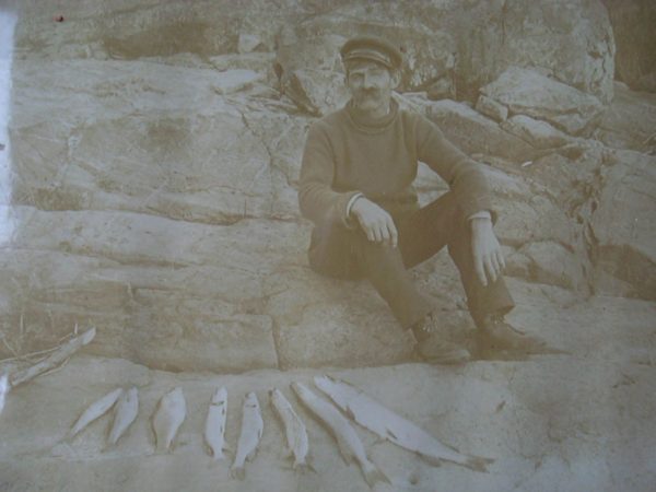 Fishing guide with his catch in Alexandria Bay