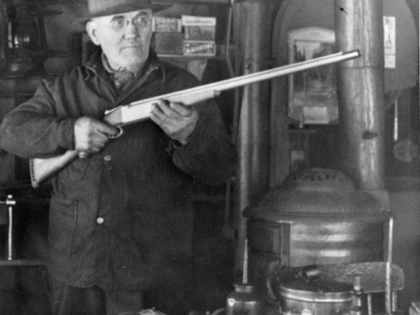 Working with a rifle inside Cranker Machine Shop in Alexandria Bay