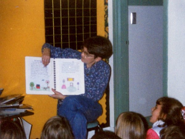 Teacher Judy Keeler reading to students in Alexandria Bay