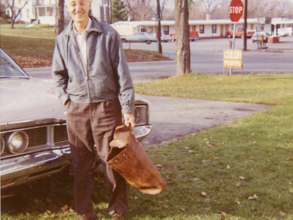 Dwight Church with his camera bag in Canton