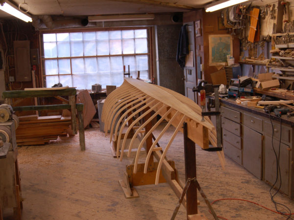 Partially constructed guideboat in the Woodward Boat Shop in Saranac Lake