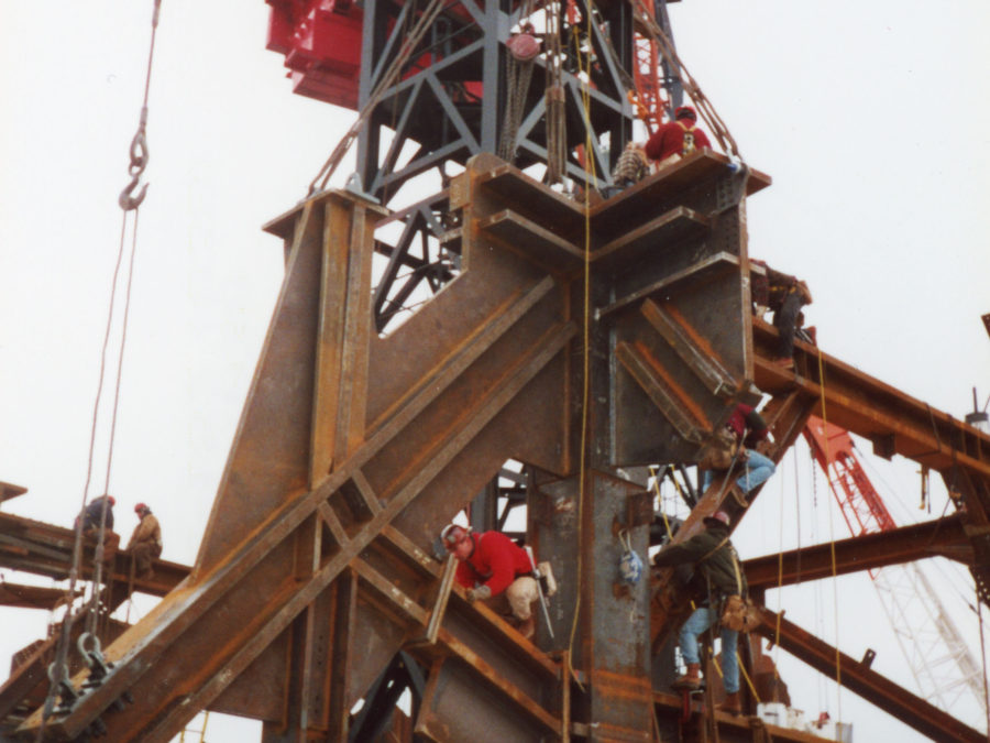 Mohawk ironworkers on a beam overlooking NYC