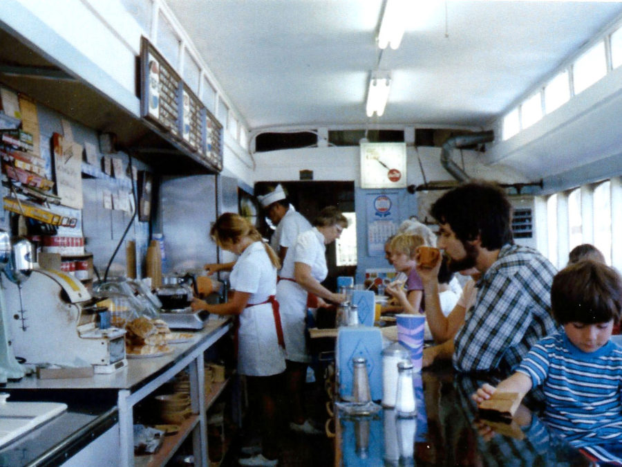 Proprietors inside general store in Bolton Landing