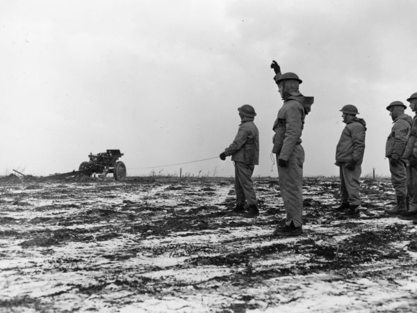 Soldiers from the 4th Armored Division firing off a cannon at Pine Camp