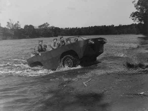 Amphibious vehicle emerging from the water at Pine Camp