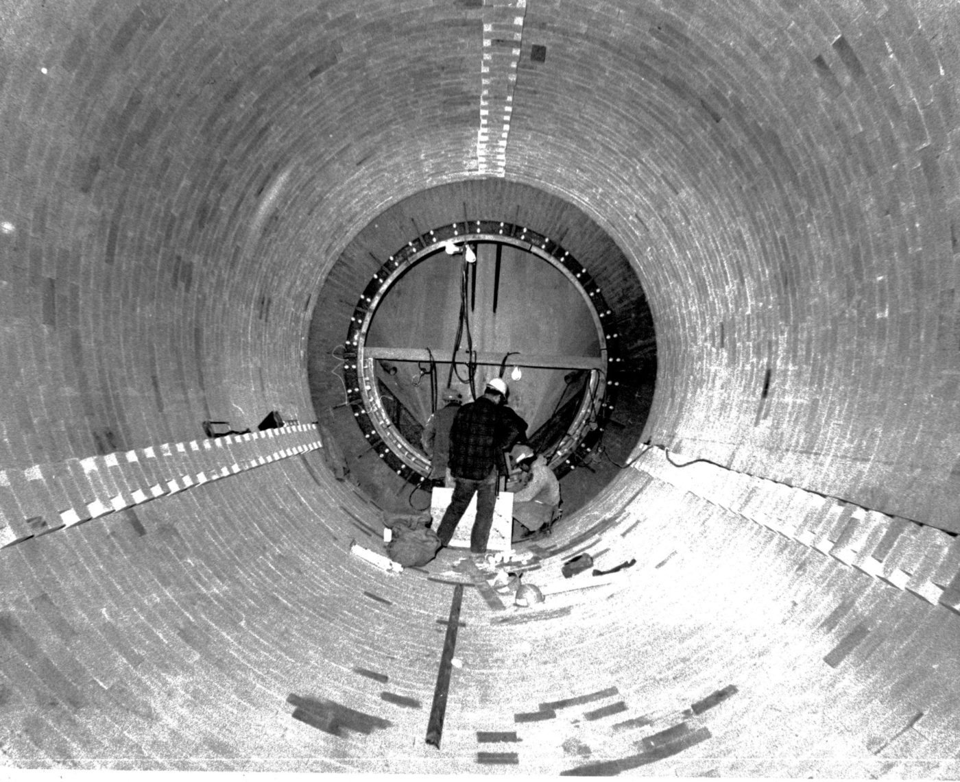 Men Working In A Large Round Structure In Glens Falls