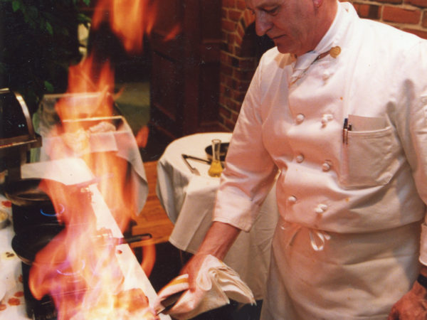 Chef Gary Fairchild flambéing dessert at the Hiland Golf Club in Glens Falls