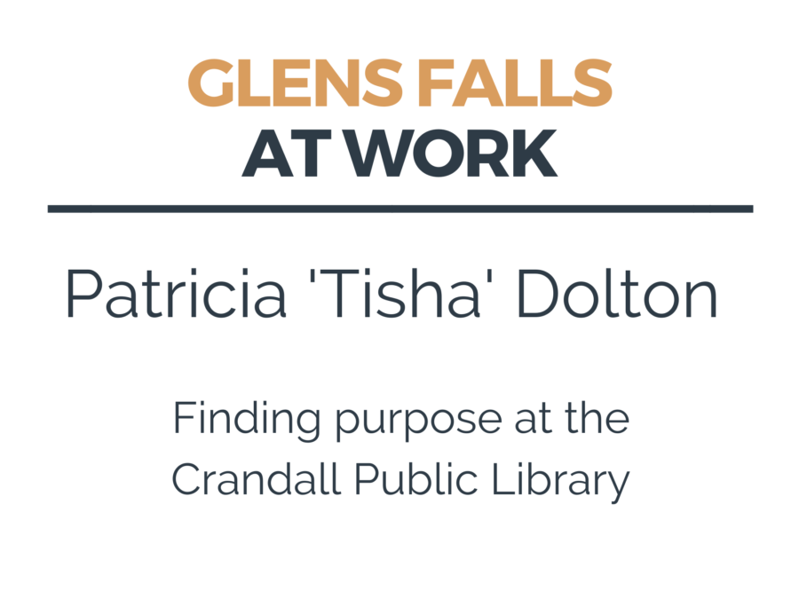 Reference Librarian and patron look through the card catalog at