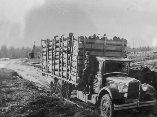 Harold Champney hauling timber for Carl Tracy’s trucking company in Colton