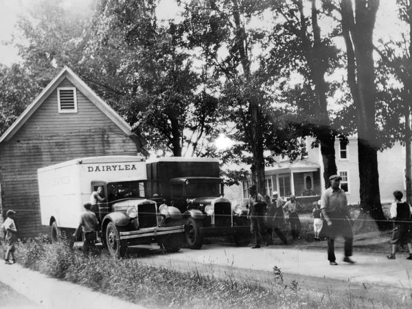 Carl Tracy moving building on Main Street in West Stockholm